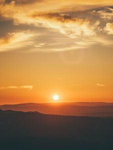 Preview wallpaper sunset, horizon, sun, hills, orange