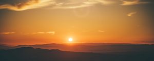 Preview wallpaper sunset, horizon, sun, hills, orange