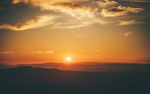 Preview wallpaper sunset, horizon, sun, hills, orange