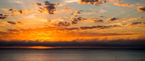 Preview wallpaper sunset, horizon, sun, sea, clouds