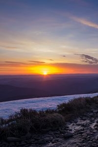 Preview wallpaper sunset, horizon, sun, snow, snowy, sky