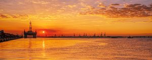 Preview wallpaper sunset, horizon, water surface, pier