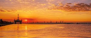 Preview wallpaper sunset, horizon, water surface, pier