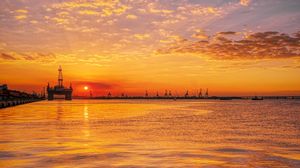 Preview wallpaper sunset, horizon, water surface, pier