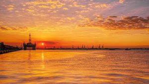 Preview wallpaper sunset, horizon, water surface, pier