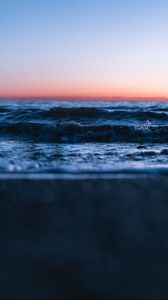 Preview wallpaper sunset, horizon, water surface, waves