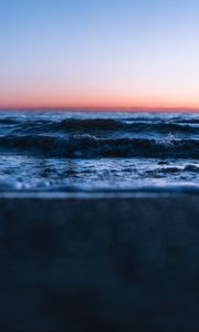 Preview wallpaper sunset, horizon, water surface, waves