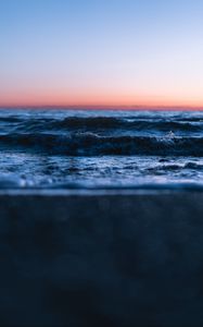 Preview wallpaper sunset, horizon, water surface, waves