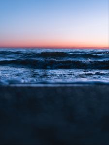 Preview wallpaper sunset, horizon, water surface, waves