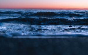 Preview wallpaper sunset, horizon, water surface, waves