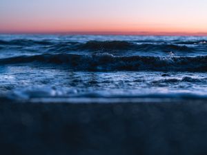 Preview wallpaper sunset, horizon, water surface, waves