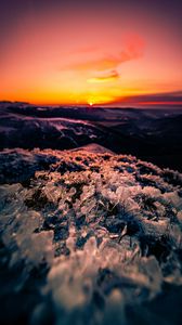 Preview wallpaper sunset, ice, grass, horizon, rocks
