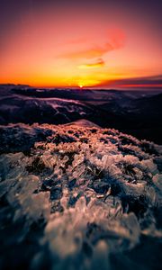 Preview wallpaper sunset, ice, grass, horizon, rocks