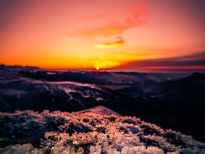 Preview wallpaper sunset, ice, grass, horizon, rocks