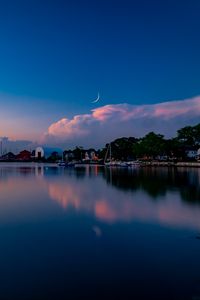 Preview wallpaper sunset, lake, moon, twilight, buildings