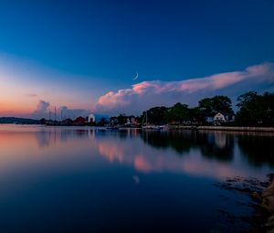 Preview wallpaper sunset, lake, moon, twilight, buildings