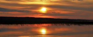 Preview wallpaper sunset, lake, sun, stones, reflection