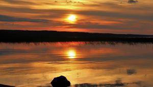 Preview wallpaper sunset, lake, sun, stones, reflection