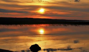 Preview wallpaper sunset, lake, sun, stones, reflection