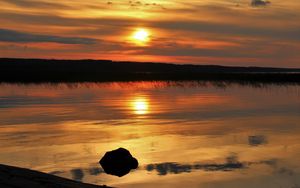 Preview wallpaper sunset, lake, sun, stones, reflection