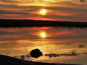 Preview wallpaper sunset, lake, sun, stones, reflection