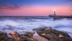 Preview wallpaper sunset, lighthouse, sea, surf, waves, stones, spain