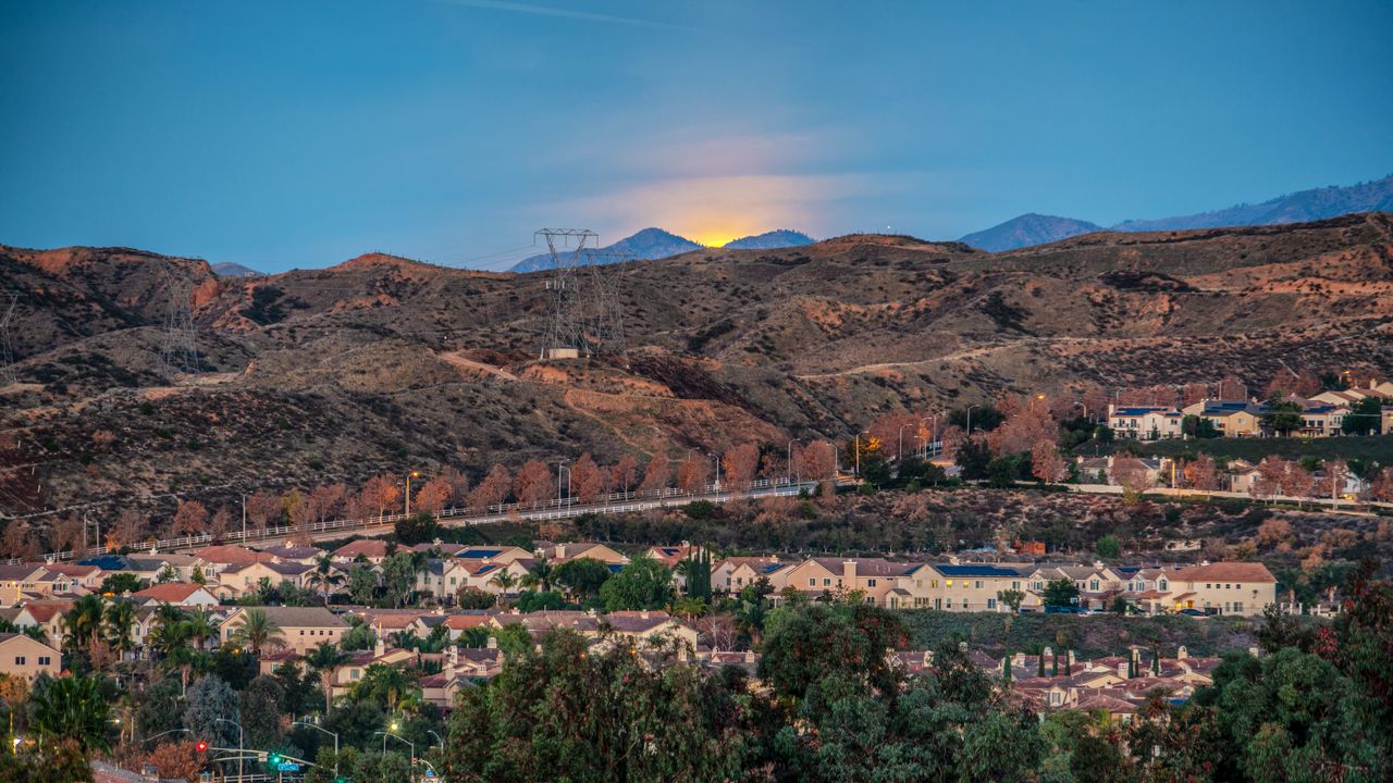 Wallpaper sunset, mountains, buildings, trees