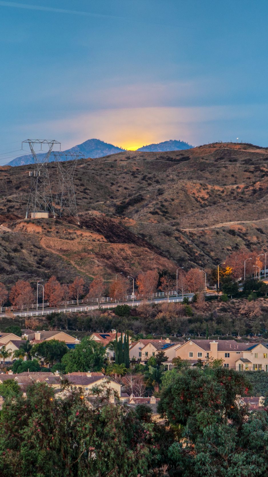 Download Wallpaper 938x1668 Sunset Mountains Buildings Trees Iphone 
