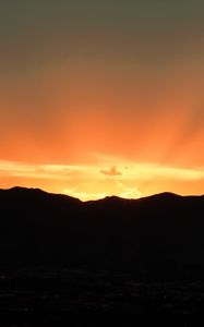 Preview wallpaper sunset, mountains, clouds, rays, dusk