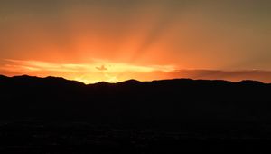 Preview wallpaper sunset, mountains, clouds, rays, dusk