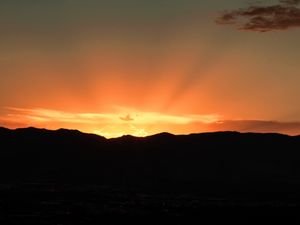 Preview wallpaper sunset, mountains, clouds, rays, dusk