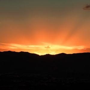 Preview wallpaper sunset, mountains, clouds, rays, dusk