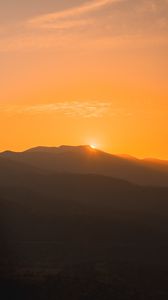 Preview wallpaper sunset, mountains, distance, valley, sky