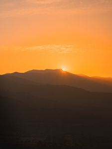 Preview wallpaper sunset, mountains, distance, valley, sky