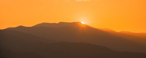 Preview wallpaper sunset, mountains, distance, valley, sky