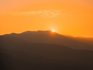 Preview wallpaper sunset, mountains, distance, valley, sky