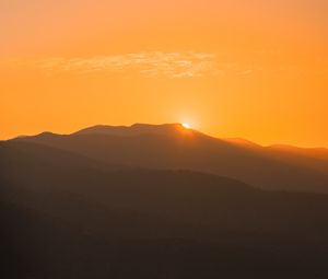 Preview wallpaper sunset, mountains, distance, valley, sky