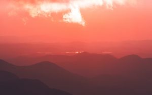 Preview wallpaper sunset, mountains, fog, clouds, dusk