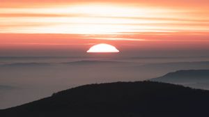 Preview wallpaper sunset, mountains, fog, dusk