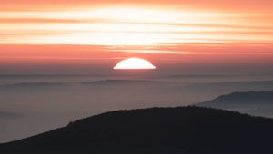 Preview wallpaper sunset, mountains, fog, dusk