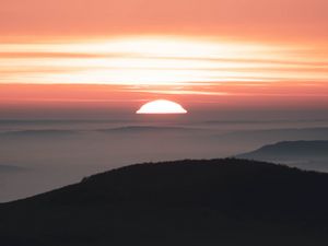 Preview wallpaper sunset, mountains, fog, dusk