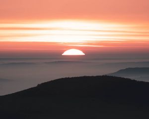 Preview wallpaper sunset, mountains, fog, dusk