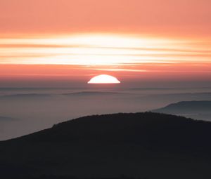 Preview wallpaper sunset, mountains, fog, dusk