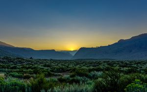 Preview wallpaper sunset, mountains, grass, distance