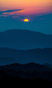 Preview wallpaper sunset, mountains, hills, clouds, dusk