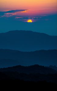 Preview wallpaper sunset, mountains, hills, clouds, dusk
