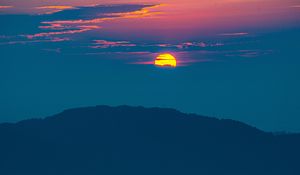 Preview wallpaper sunset, mountains, hills, clouds, dusk