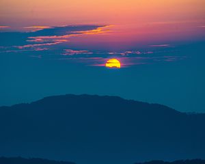 Preview wallpaper sunset, mountains, hills, clouds, dusk