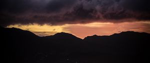 Preview wallpaper sunset, mountains, hills, sky, clouds