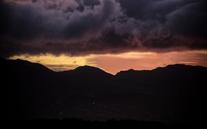 Preview wallpaper sunset, mountains, hills, sky, clouds